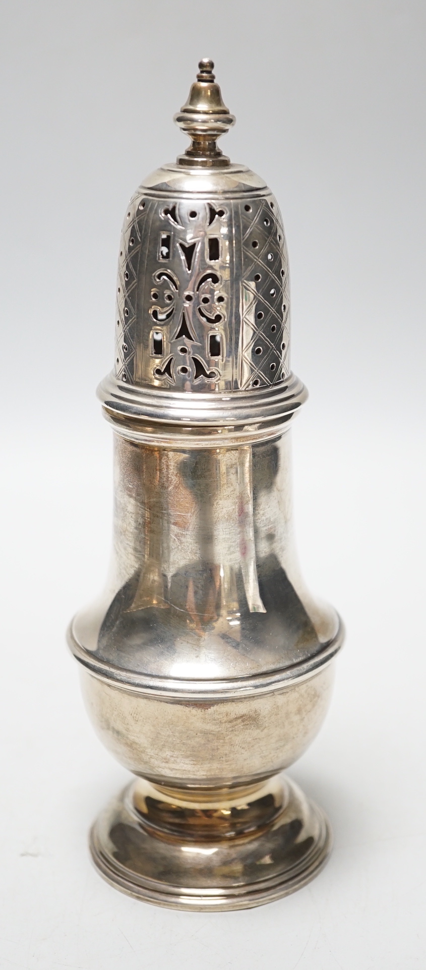 A George V silver baluster sugar caster, London, 1933, 18.9cm, 6.6oz.